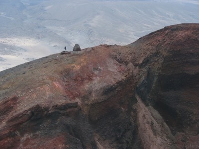 Climber on red crater