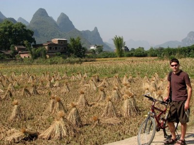 Joe with rice stalks drying