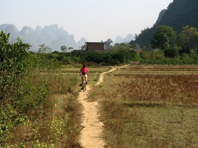 Penny biking on tiny path