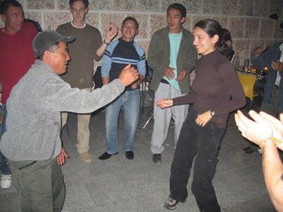 Penny dances with locals